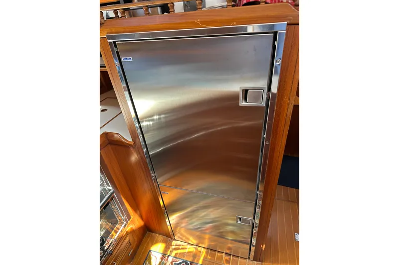 Slide: The Image of Stainless steel refrigerator on 1987 Albin North Sea Trawler, wooden interior. - 66