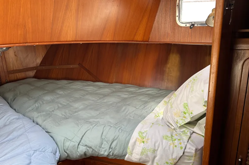 Slide: The Image of Cozy cabin bed in 1987 Albin North Sea Trawler with wooden interior. - 70