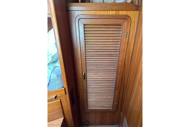 Slide: The Image of 1987 Albin North Sea Trawler wooden interior with louvered cabinet door. - 71