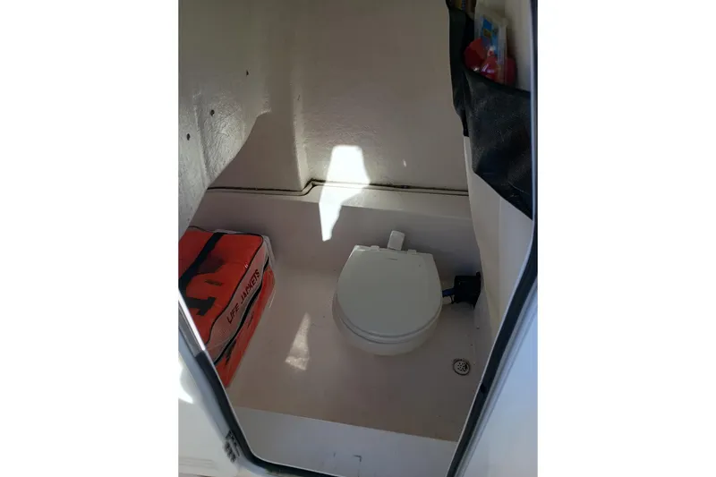 Slide: The Image of Interior of 2021 Sea Fox 228 Commander boat with toilet and life jackets. - 16