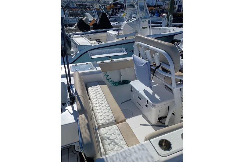 Slide: The Image of 2021 Sea Fox 228 Commander boat interior with seating and fishing rod holders. - 17
