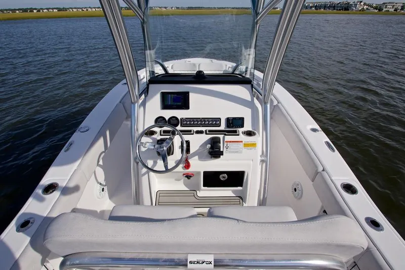 Slide: The Image of Manufacturer Provided Image: 2021 Sea Fox 228 Commander boat dashboard and helm station on the water. - 21