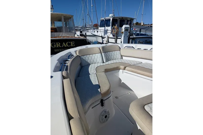 Slide: The Image of 2021 Sea Fox 228 Commander boat with cushioned seating at marina. - 5