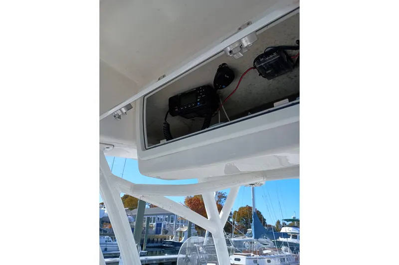 Slide: The Image of 2021 Sea Fox 228 Commander electronics compartment with radio and wiring. - 7