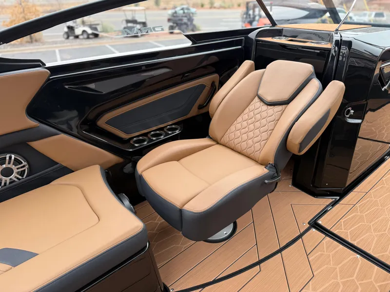 Slide: The Image of 2025 Yamaha Boats 255XD interior with luxurious tan and black seating, modern design. - 33