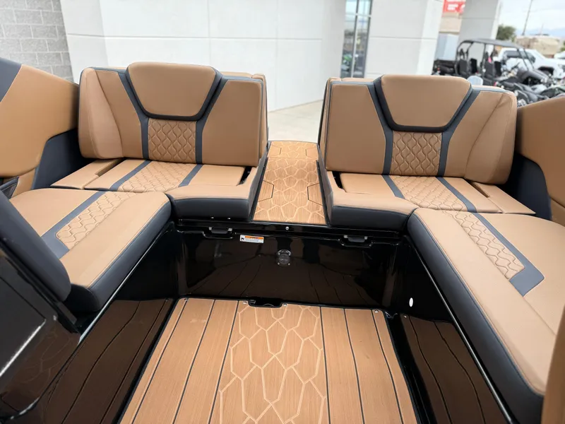 Slide: The Image of 2025 Yamaha Boats 255XD interior with tan and black seating, modern design. - 39