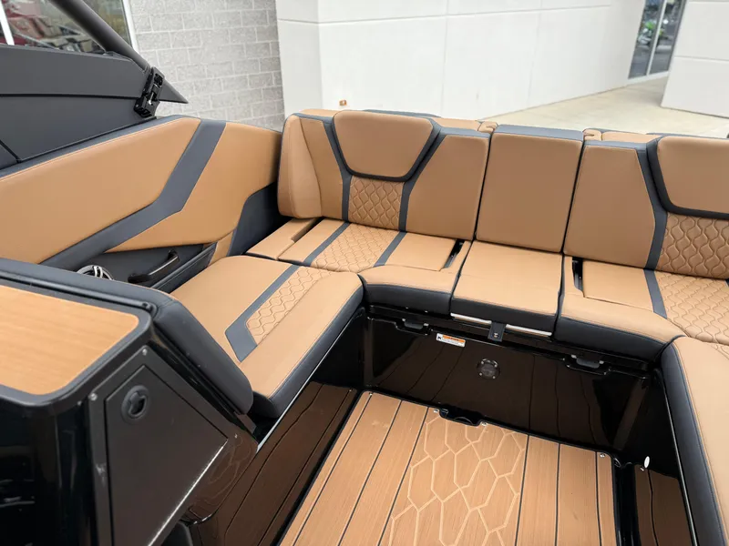 Slide: The Image of 2025 Yamaha Boats 255XD interior with tan and black seating, modern design. - 40