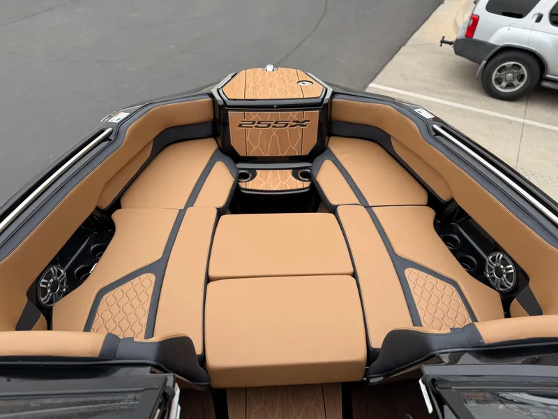 Slide: The Image of 2025 Yamaha Boats 255XD interior with tan seating and sleek design. - 62