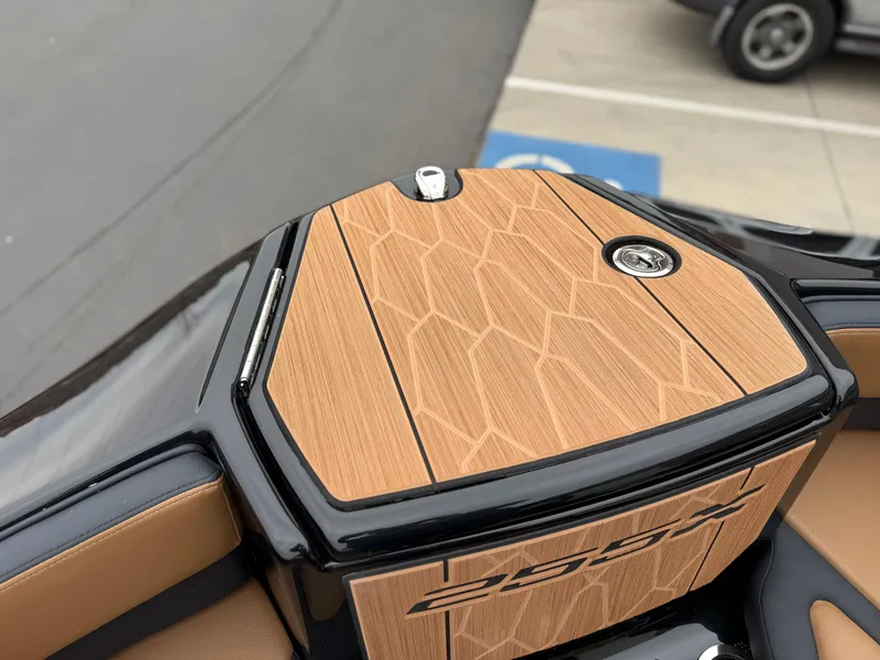 Slide: The Image of 2025 Yamaha Boats 255XD, featuring sleek wood-patterned deck and modern design elements. - 70