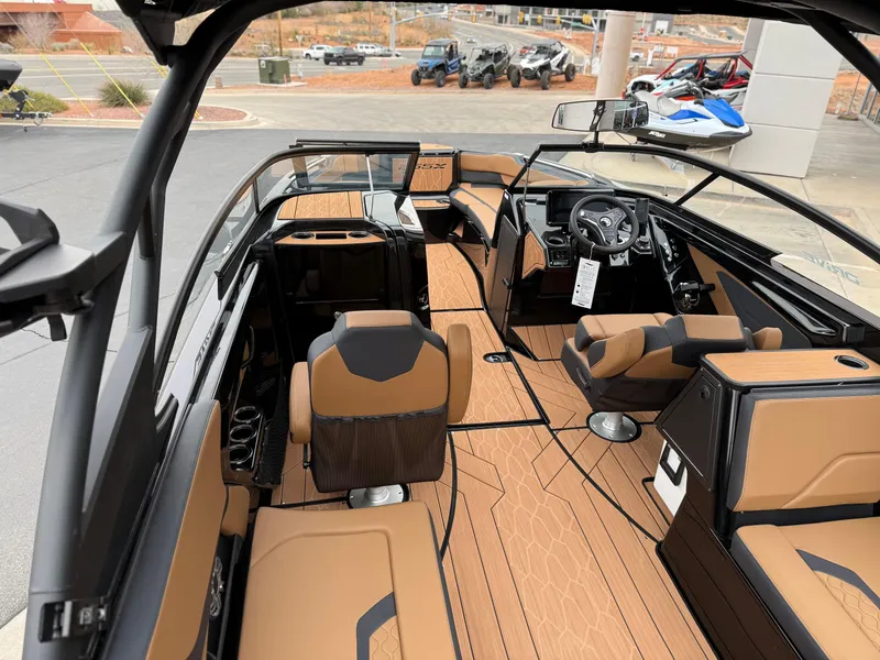 Slide: The Image of 2025 Yamaha Boats 255XD interior with luxurious seating and modern dashboard design. - 77