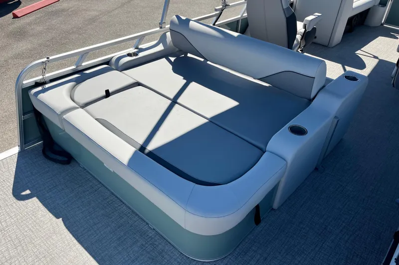 Slide: The Image of 2026 Avalon 2585 Venture 85 VRB Tri Toon boat interior with gray seating and cup holders. - 10
