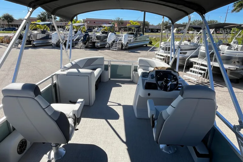 Slide: The Image of 2026 Avalon 2585 Venture 85 VRB Tri Toon boat interior with seating and steering console. - 11