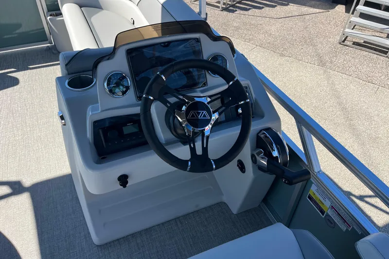 Slide: The Image of 2026 Avalon 2585 Venture 85 VRB boat helm with modern steering and controls. - 12