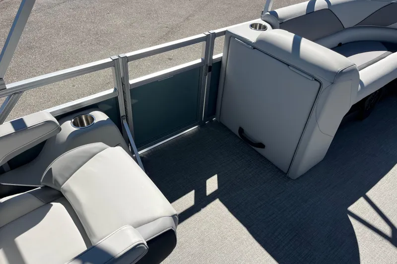 Slide: The Image of 2026 Avalon 2585 Venture 85 VRB Tri Toon interior with gray seating and cup holders. - 13