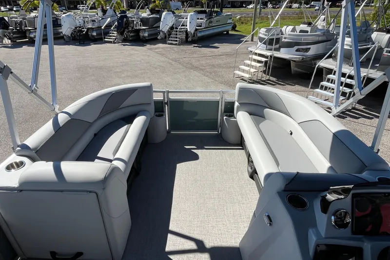 Slide: The Image of 2026 Avalon 2585 Venture 85 VRB Tri Toon boat interior with gray seating and helm. - 14