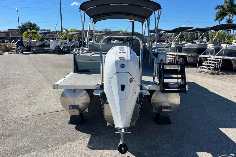 Slide: The Image of 2026 Avalon 2585 Venture 85 VRB Tri Toon boat with high-performance engine, docked outdoors. - 6