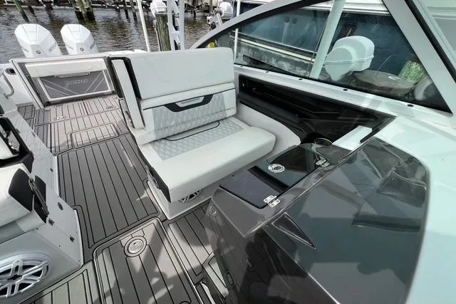 Slide: The Image of 2023 Blackfin 272 DC boat interior with sleek seating and modern design. - 15