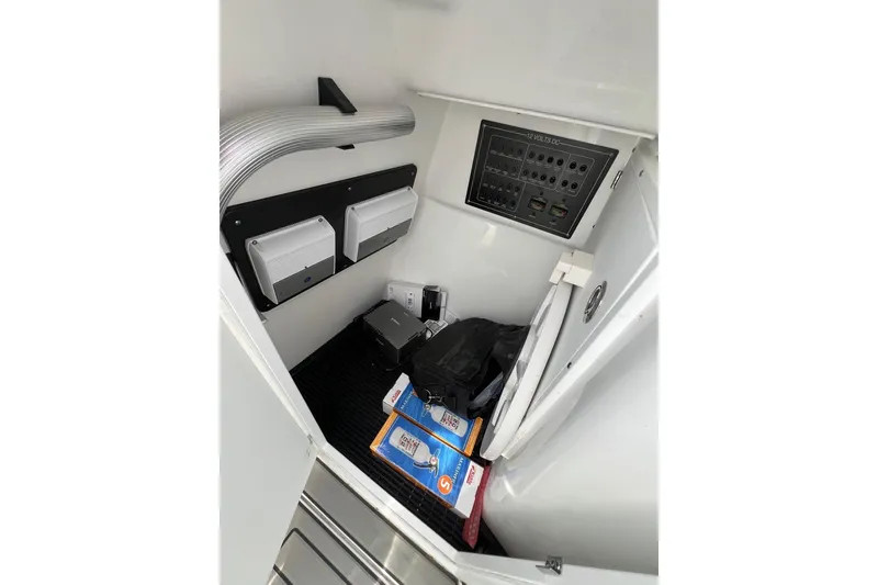 Slide: The Image of 2023 Blackfin 272 DC interior storage with electrical panel and equipment. - 18