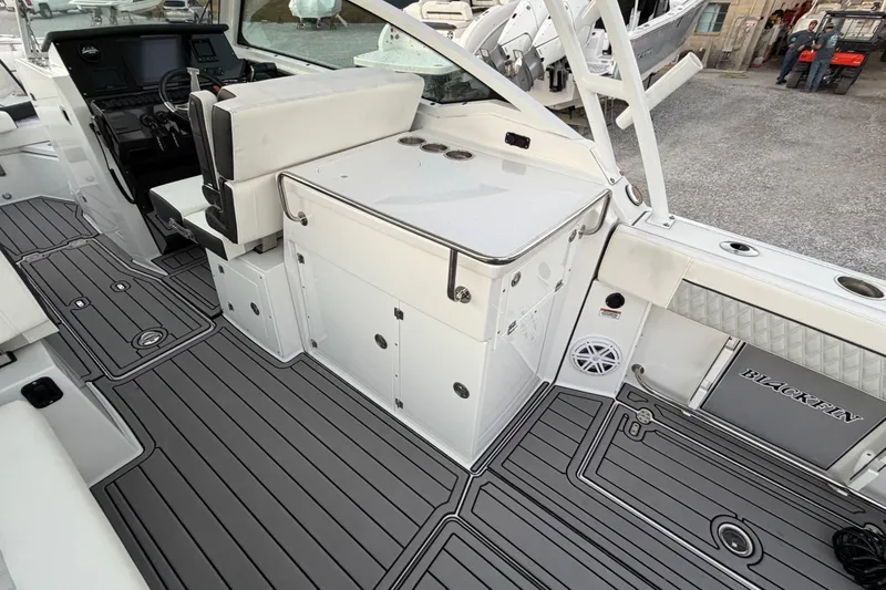 Slide: The Image of 2023 Blackfin 272 DC boat interior with sleek seating and modern dashboard. - 29