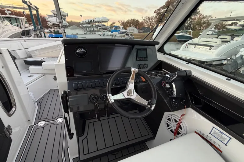Slide: The Image of 2023 Blackfin 272 DC boat cockpit with modern steering and control panel. - 30