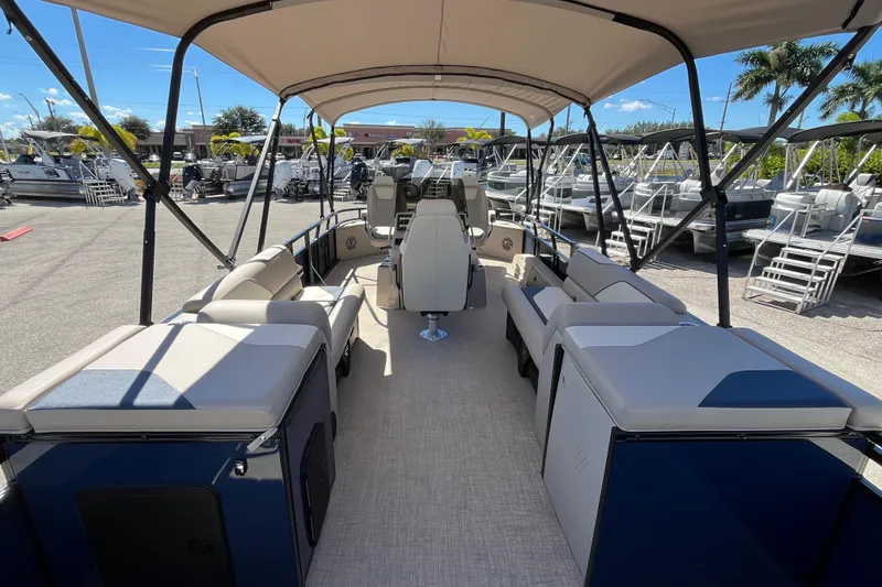 Slide: The Image of 2025 Avalon 2585 Venture 85 Tri Toon boat with center console, spacious seating, and canopy. - 10