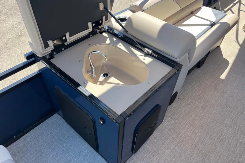 Slide: The Image of 2025 Avalon 2585 Venture boat with center console sink and seating area. - 11