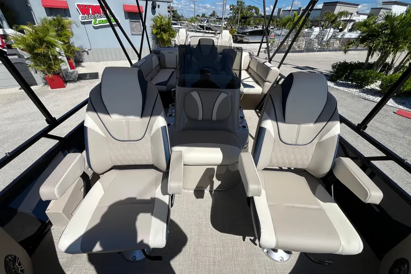 Slide: The Image of 2025 Avalon 2585 Venture boat interior with luxurious seating and center console. - 18