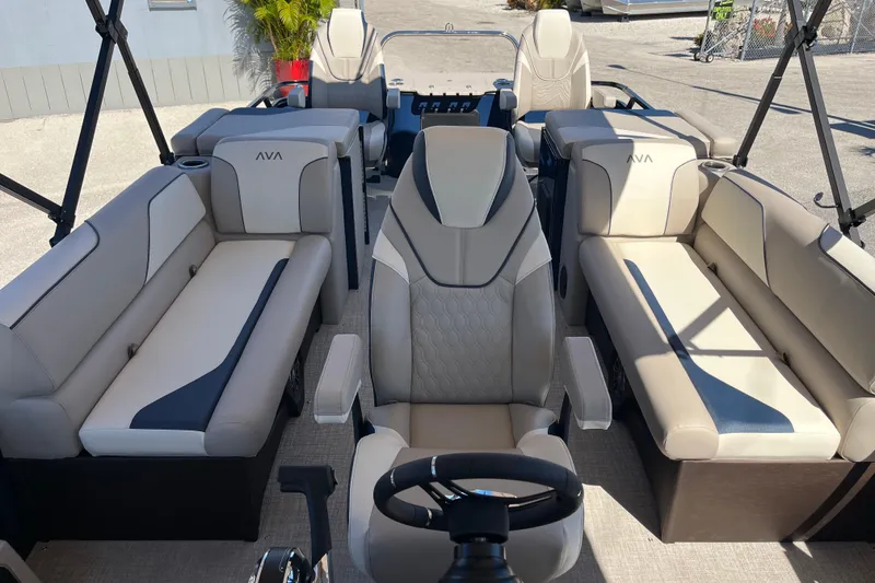 Slide: The Image of 2025 Avalon 2585 Venture 85 Center Console Fish boat interior with luxurious seating and steering console. - 19
