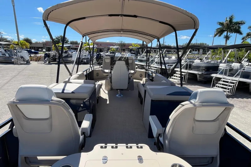 Slide: The Image of 2025 Avalon 2585 Venture 85 Tri Toon boat with center console, spacious seating, and canopy. - 9