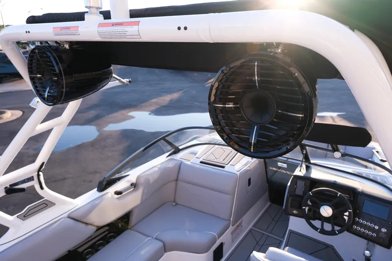 Slide: The Image of 2026 Moomba Max boat interior with speakers and steering wheel, showcasing modern design. - 16