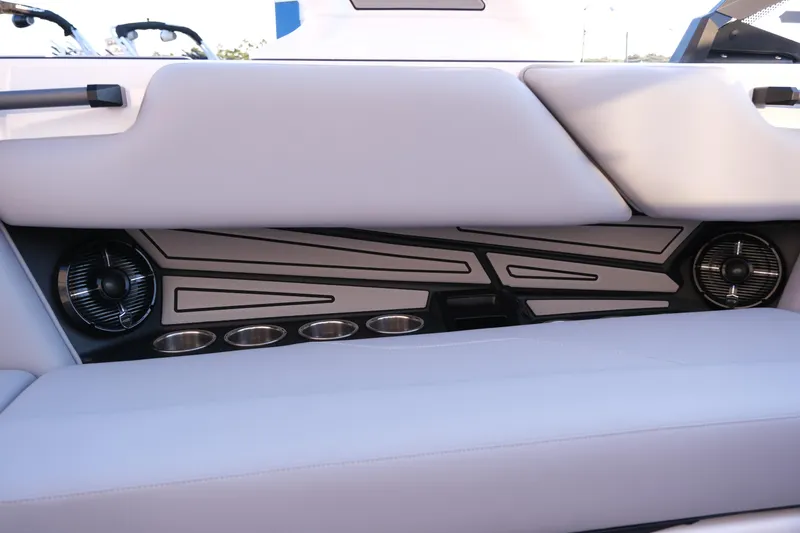 Slide: The Image of 2026 Moomba Max boat interior with sleek seating, cup holders, and integrated speakers. - 17