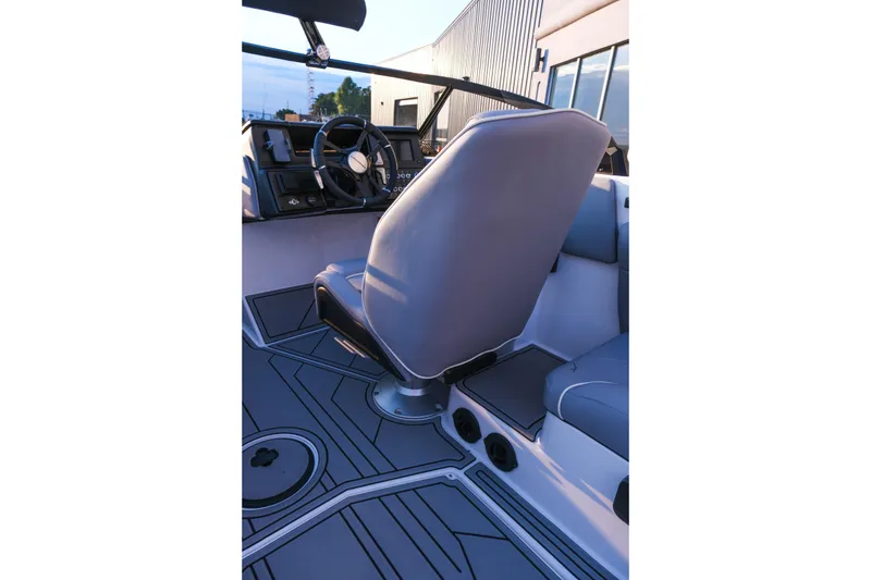 Slide: The Image of 2026 Moomba Max boat interior with steering wheel and captain's seat, showcasing modern design. - 20
