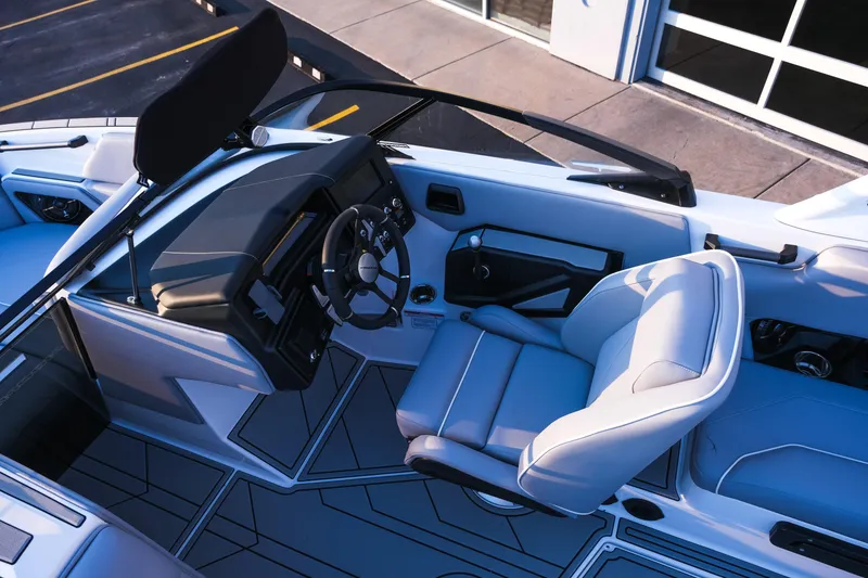 Slide: The Image of 2026 Moomba Max boat interior with modern steering and seating design. - 21