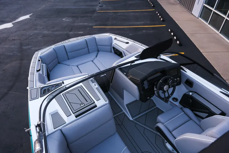 Slide: The Image of 2026 Moomba Max boat interior with modern seating and sleek dashboard design. - 28