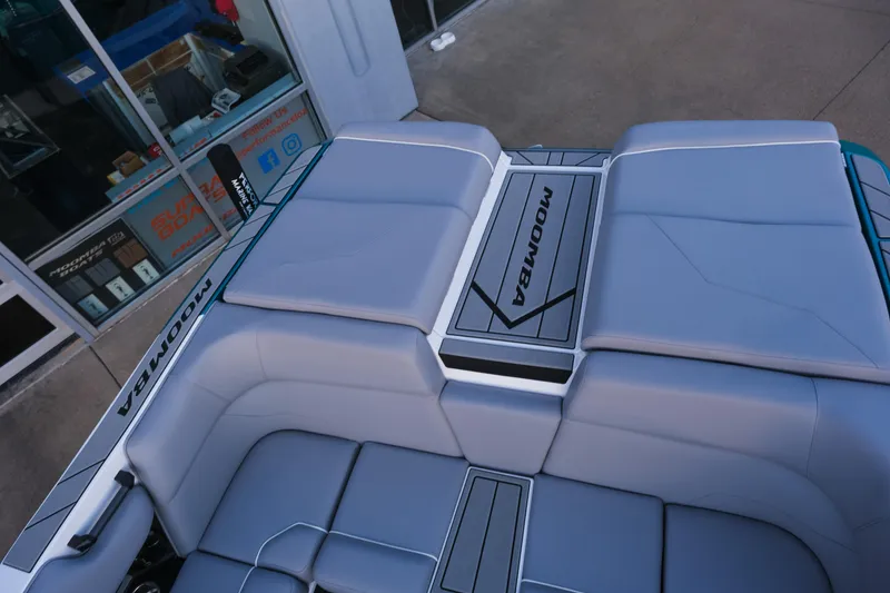 Slide: The Image of 2026 Moomba Max boat interior with sleek gray seating and branded detailing. - 29