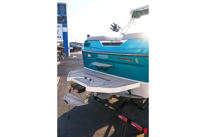Slide: The Image of 2026 Moomba Max boat rear view with swim platform and Raptor engine branding. - 7