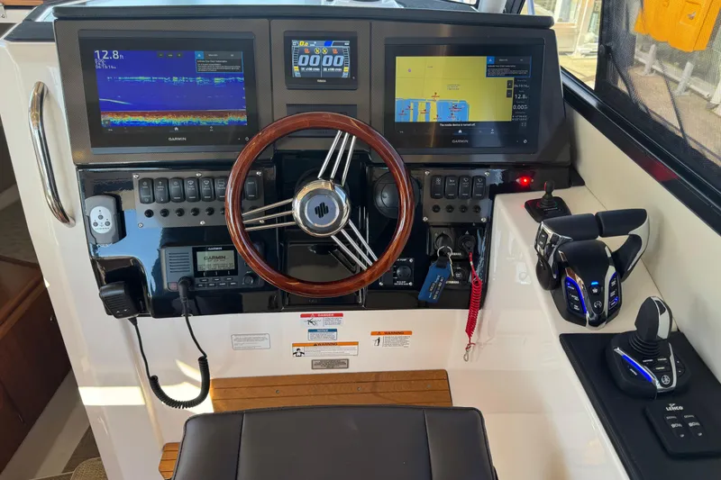 Slide: The Image of Helm of 2026 Cutwater C-288 CB with advanced navigation and control systems. - 11