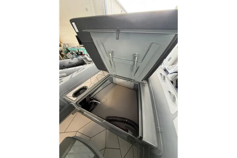 Slide: The Image of Open storage compartment of 2025 Highfield Sport 800 boat, showcasing interior space. - 11