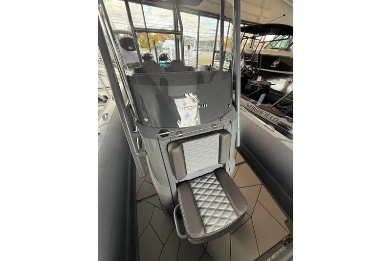 Slide: The Image of 2025 Highfield Sport 800 boat interior with sleek seating and modern design. - 12