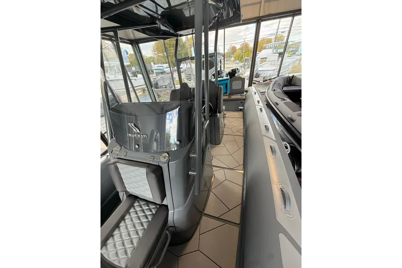 Slide: The Image of 2025 Highfield Sport 800 boat interior with modern seating and sleek design. - 13