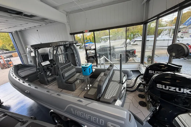 Slide: The Image of 2025 Highfield Sport 800 boat with Suzuki engines in showroom display. - 18
