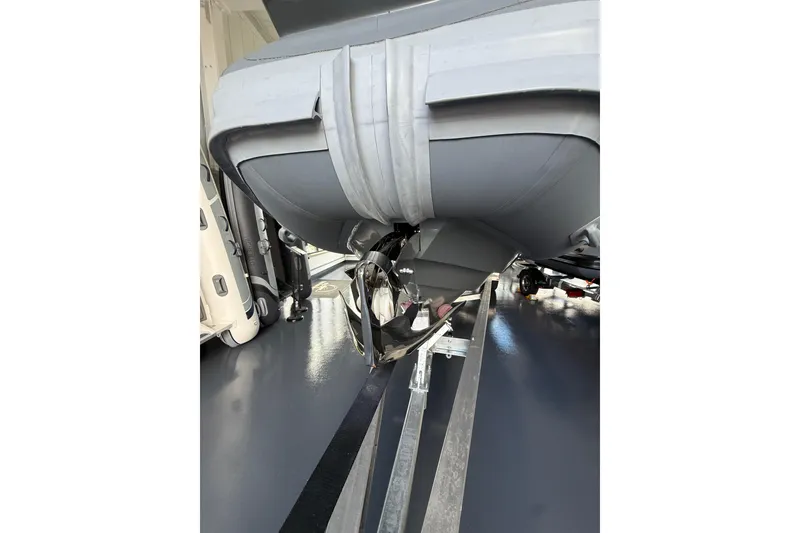 Slide: The Image of Highfield Sport 800 (2025) boat on trailer, showcasing hull and propeller details. - 23