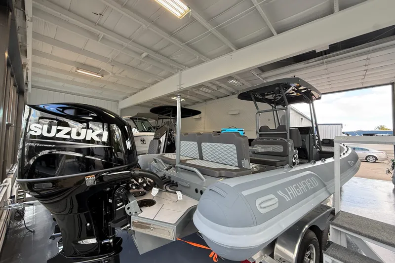Slide: The Image of 2025 Highfield Sport 800 boat with Suzuki engine in showroom. - 4