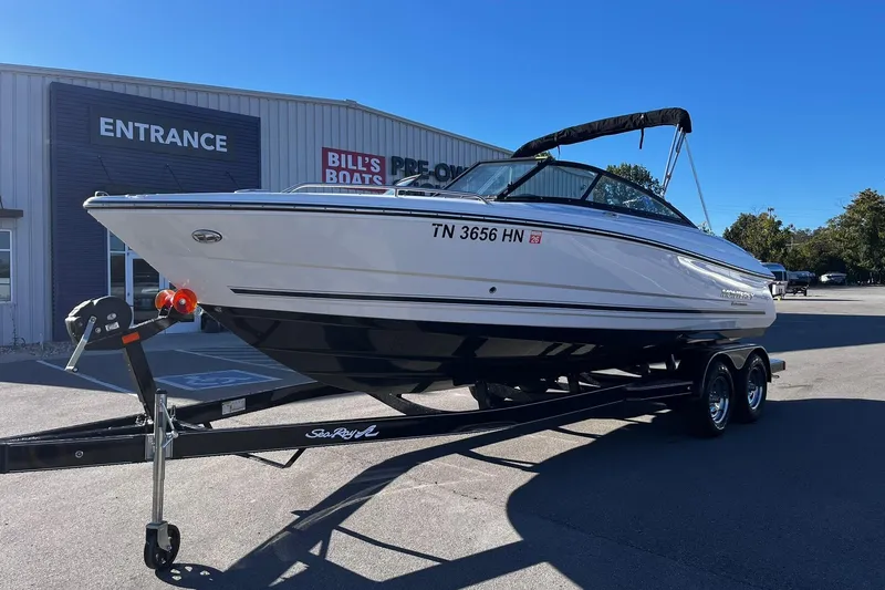 Slide: The Image of 2022 Monterey 224FS boat on trailer outside Bill's Boats dealership. - 1