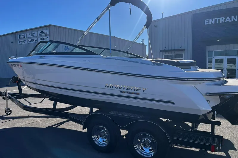 Slide: The Image of 2022 Monterey 224FS boat on trailer outside dealership. - 3