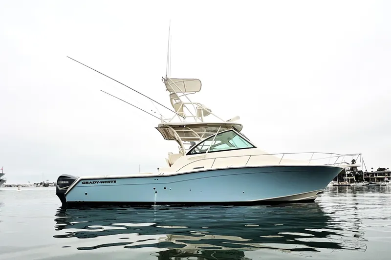 The Image of 2018 Grady-White Express 370 boat on calm water, side view. - 0