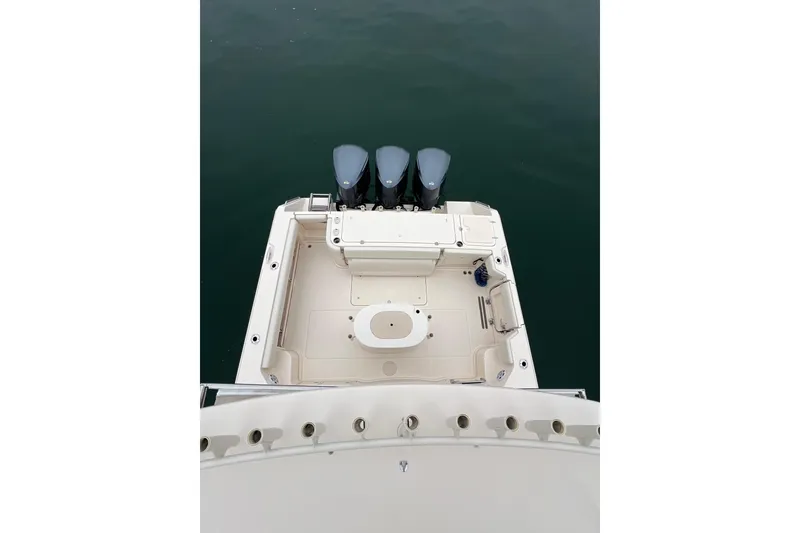 Slide: The Image of 2018 Grady-White Express 370 boat deck with triple outboard motors. - 14