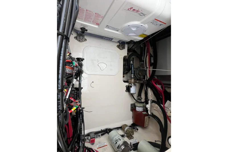 Slide: The Image of Engine compartment of 2018 Grady-White Express 370 boat, showcasing mechanical components. - 19