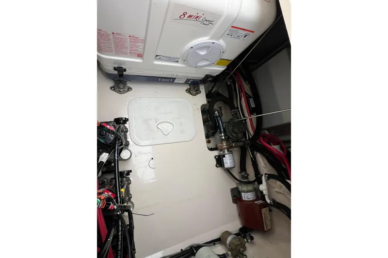 Slide: The Image of Engine compartment of 2018 Grady-White Express 370 boat, showcasing wiring and components. - 20