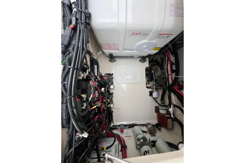 Slide: The Image of Engine compartment of 2018 Grady-White Express 370 boat, showcasing wiring and components. - 21